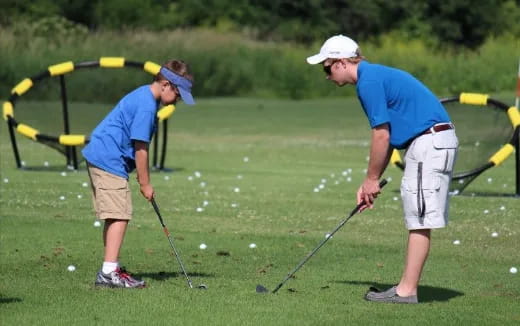 a couple of men playing golf