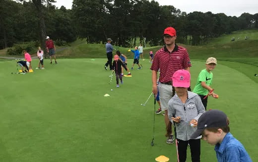 a group of people playing golf