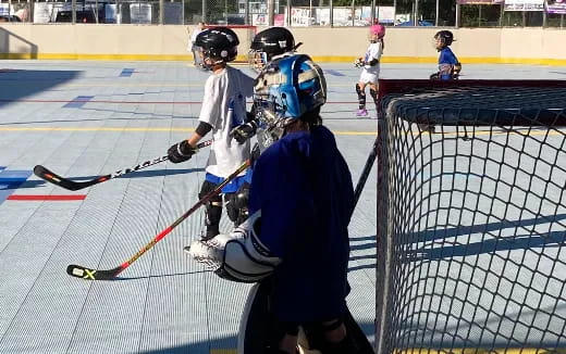 a group of people playing hockey