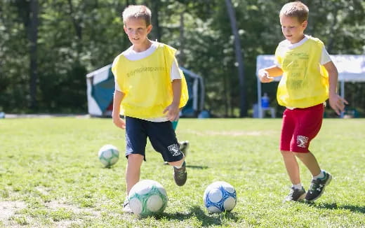 kids playing with football balls