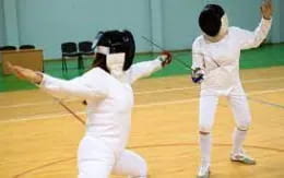 a couple of people in karate uniforms