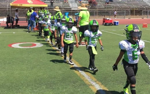 a group of kids wearing football gear