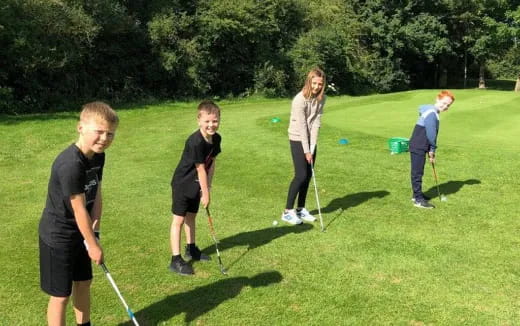 a group of people playing golf