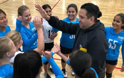 a group of people in a gym