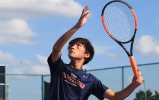 a man playing tennis