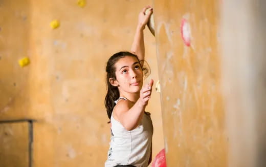 a woman painting a wall