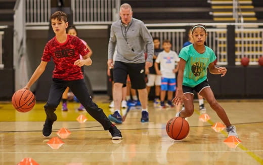 a group of girls playing basketball