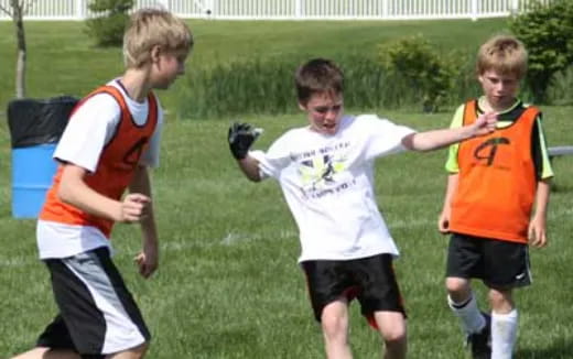 a group of boys playing football
