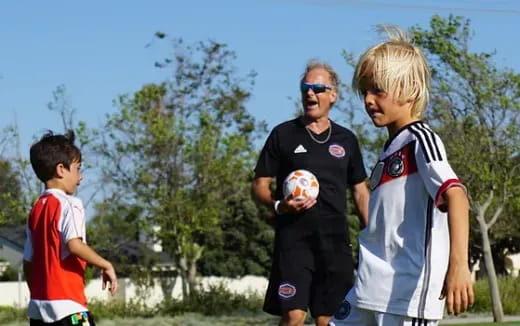 a group of boys playing football