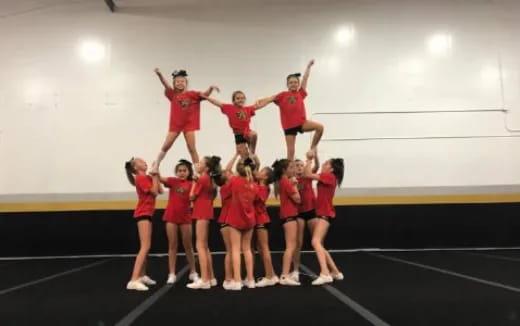 a group of girls in red uniforms
