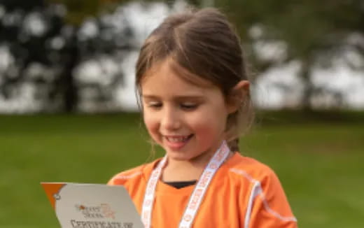 a girl holding a book