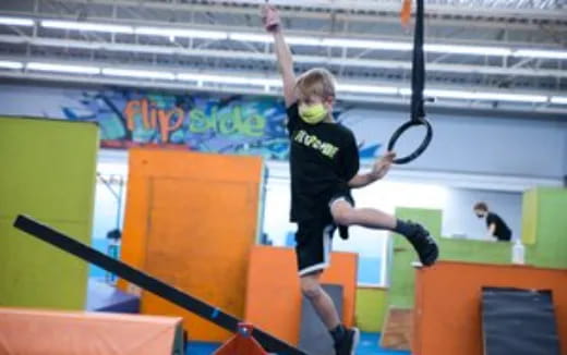 a person jumping over a bar