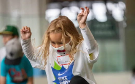 a girl with her hands up