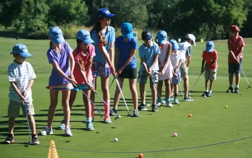 a group of people playing golf