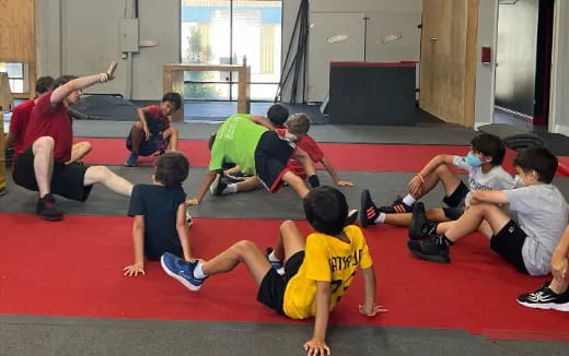 a group of people sitting on the floor