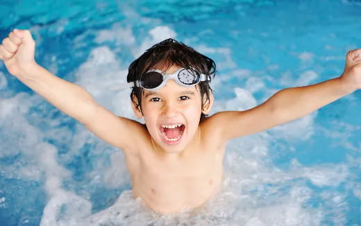 a boy in a pool