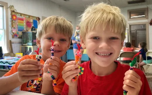 a couple of boys holding toy guns