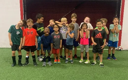 a group of kids posing for a photo