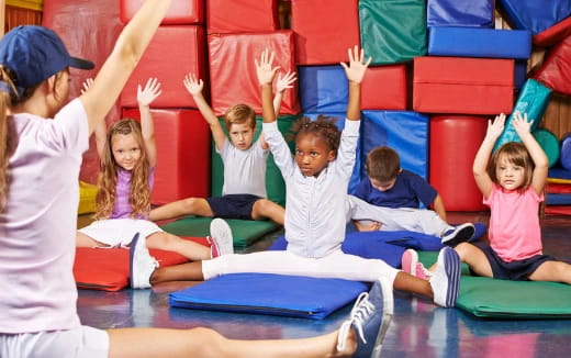 a group of children sitting on the floor