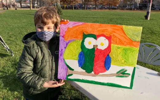 a child holding a kite