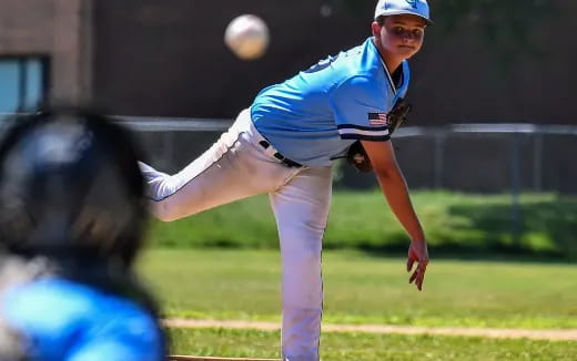 a baseball player throwing a ball