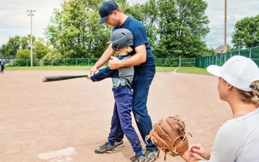 a baseball player prepares to swing a bat