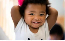 a boy with his arms raised