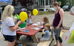 a group of people playing with toys