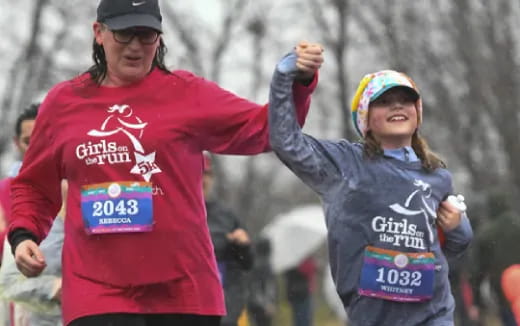 a man and woman running