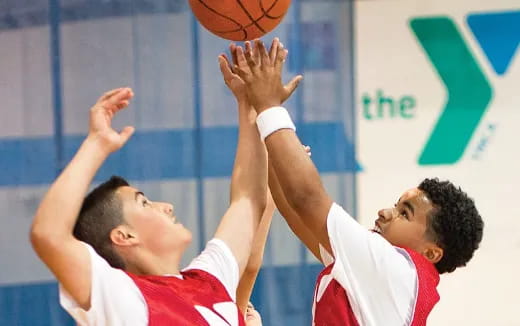 a few men playing basketball