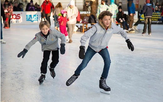 a person and a boy ice skating