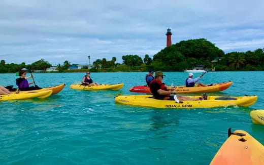 a group of people in kayaks