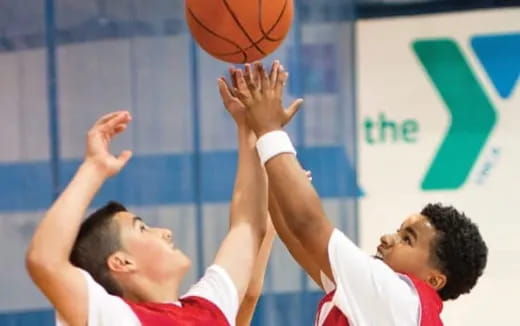 a few men playing basketball