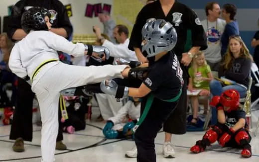 a group of people in a fighting ring
