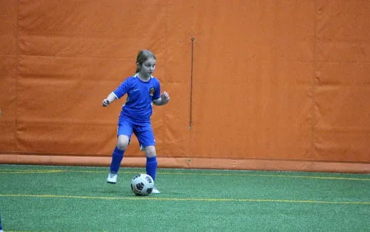 a girl playing football