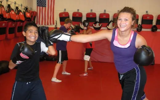 a group of people lifting weights