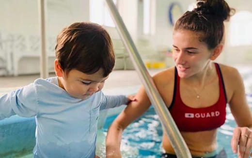 a person and a boy playing a violin