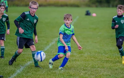 a group of boys playing football
