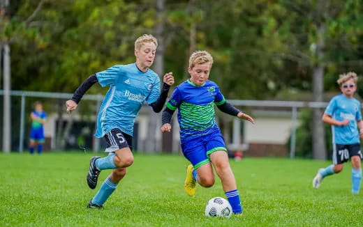 kids playing football on a field