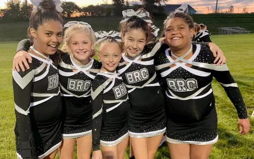 a group of girls in athletic uniforms