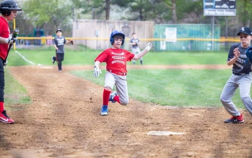 a young boy playing baseball