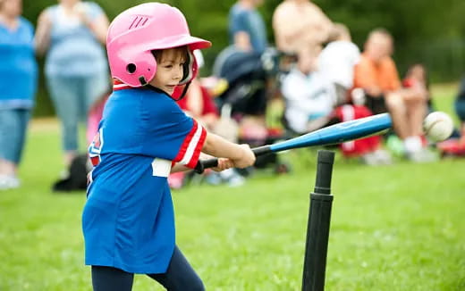 a young boy playing baseball