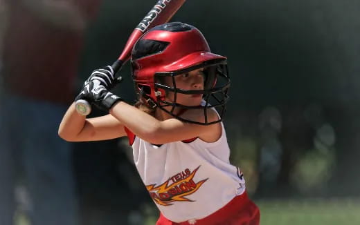 a young boy playing baseball