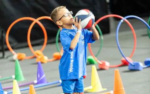 a boy holding a ball