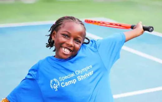 a person holding a tennis racket