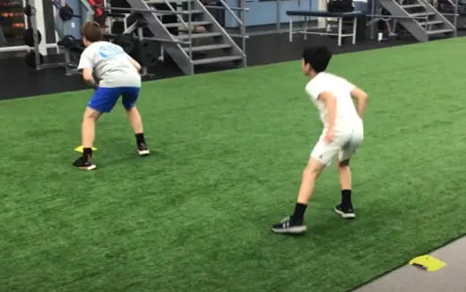 a couple of men playing football