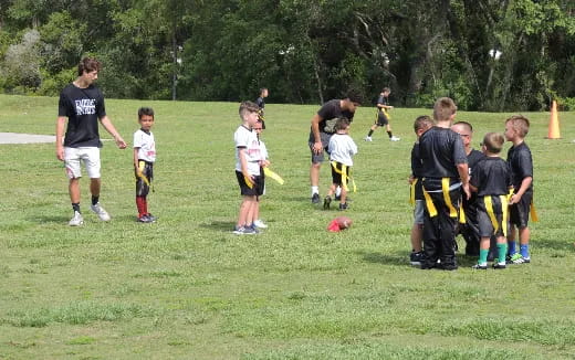 a group of kids playing football