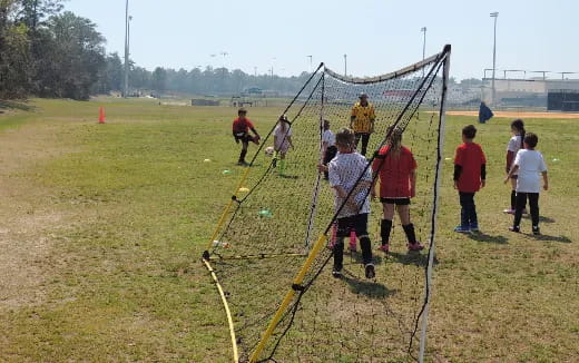 a group of people playing football