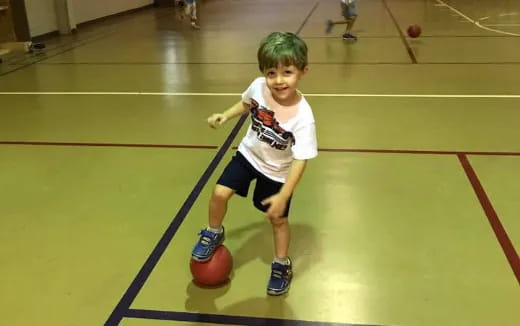 a boy playing basketball