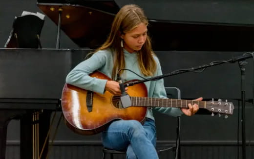 a person playing a guitar